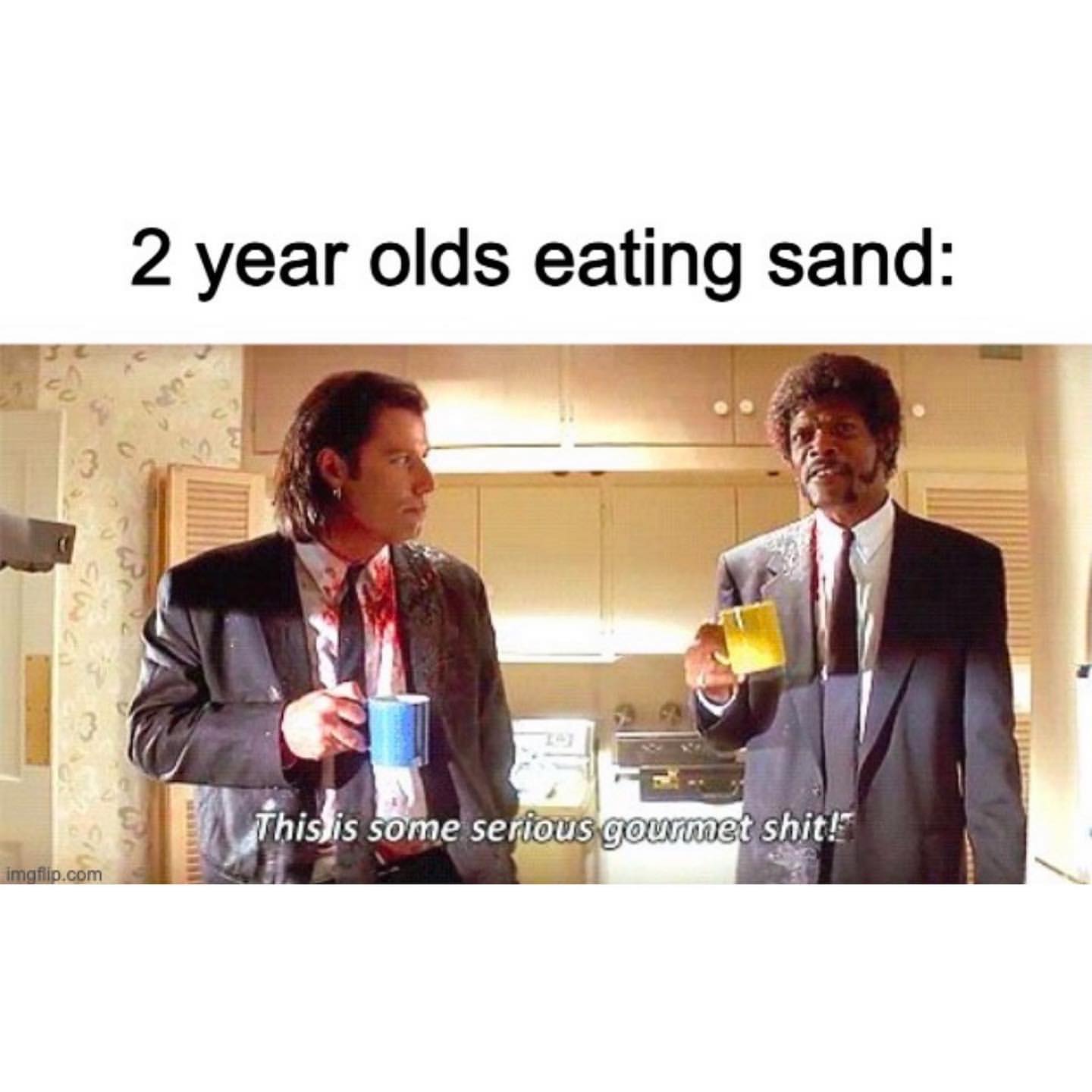 2 year olds eating sand: This is some serious gourmet shit!