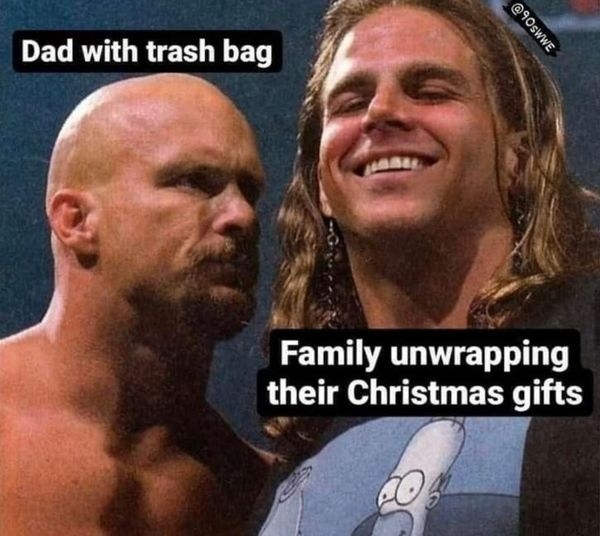 Dad with trash bag. Family unwrapping their Christmas gifts.