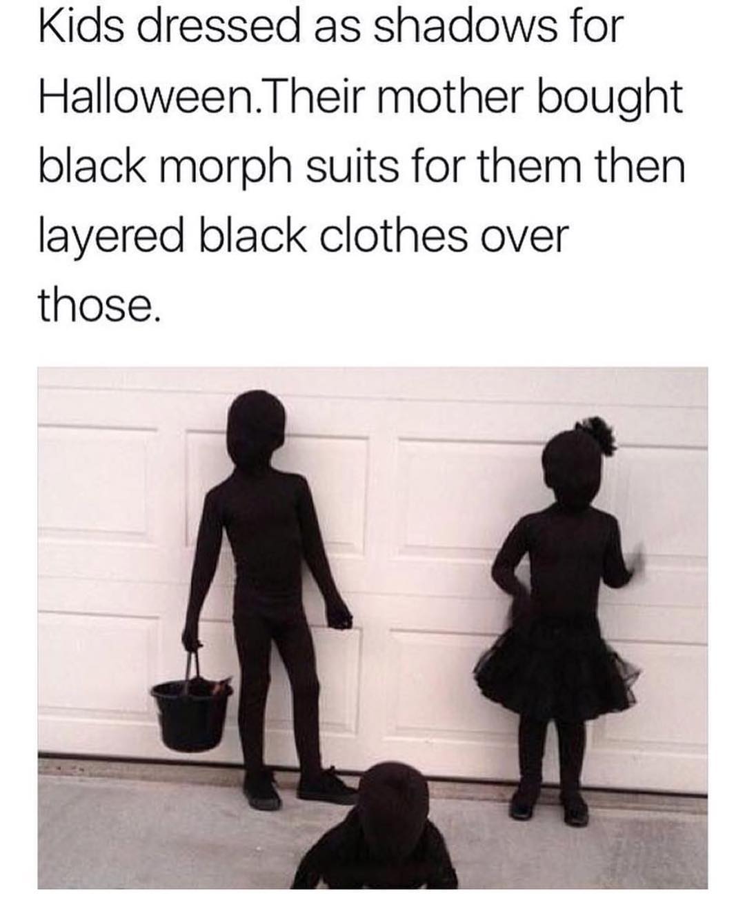 Kids dressed as shadows for Halloween. Their mother bought black morph suits for them then layered black clothes over those.
