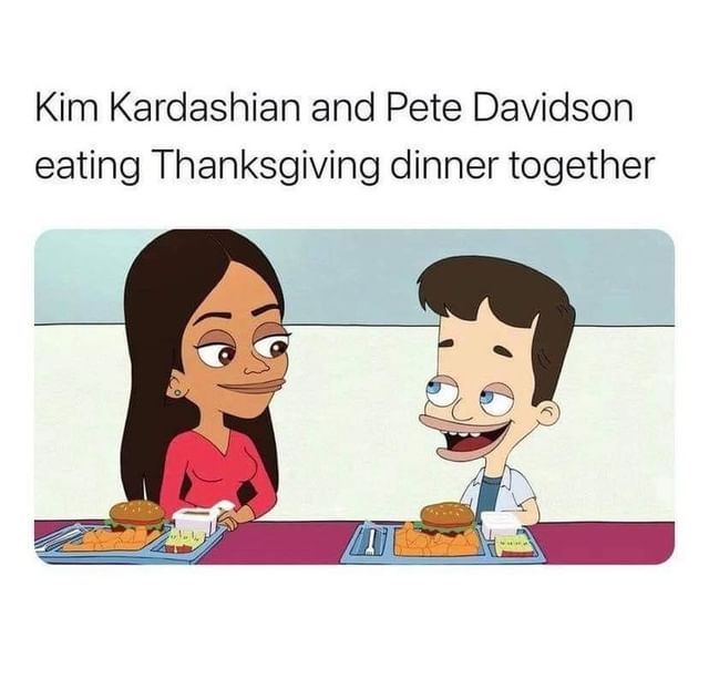 Kim Kardashian and Pete Davidson eating Thanksgiving dinner together.