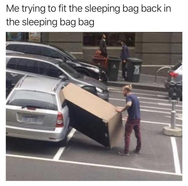 Me trying to fit the sleeping bag back in the sleeping bag bag.