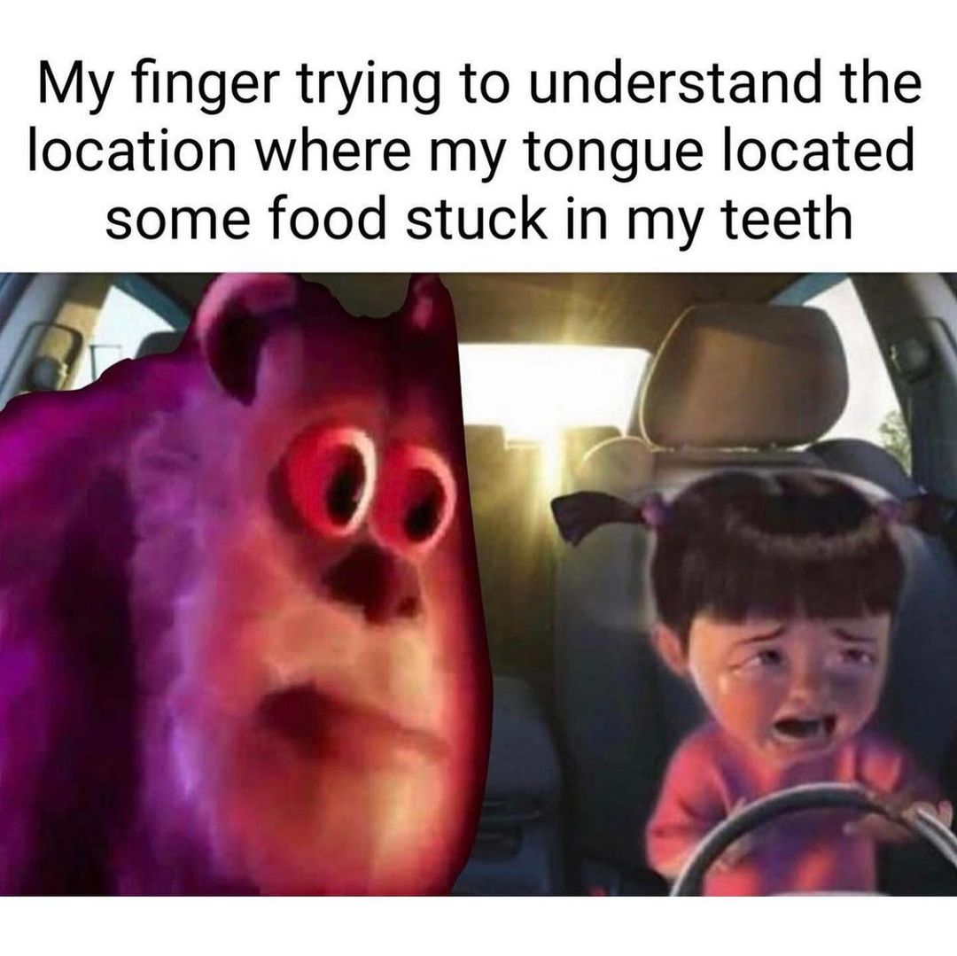 My finger trying to understand the location where my tongue located some food stuck in my teeth.