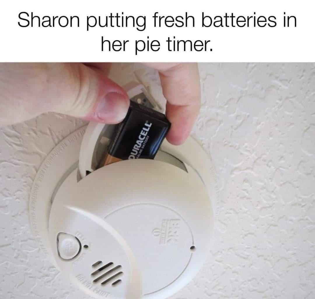 Sharon putting fresh batteries in her pie timer.
