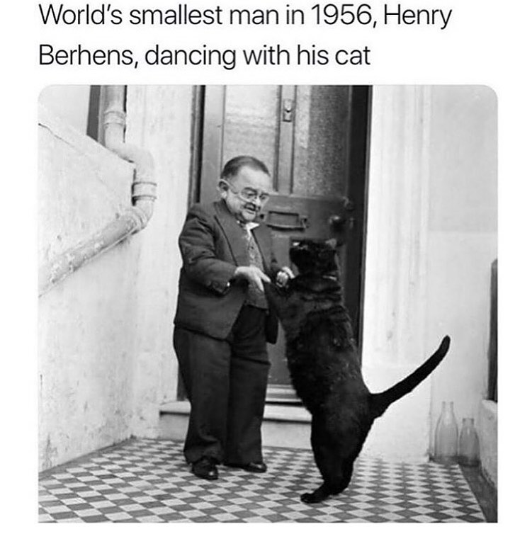World's smallest man in 1956, Henry Berhens, dancing with his cat.